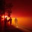 Firefighters monitor flames as they approach a residence in the valley area of Vacaville, northern California during the LNU Lightning Complex fire on August 19, 2020. Credit: Josh Edelson/AFP via Getty Images