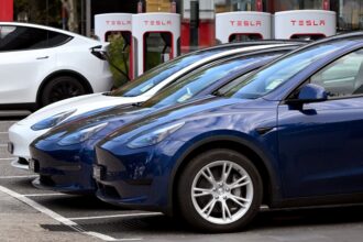 Electric vehicles (EV) line up outside a Tesla dealership in Melbourne on April 19, 2023. Credit: William West/AFP via Getty Images