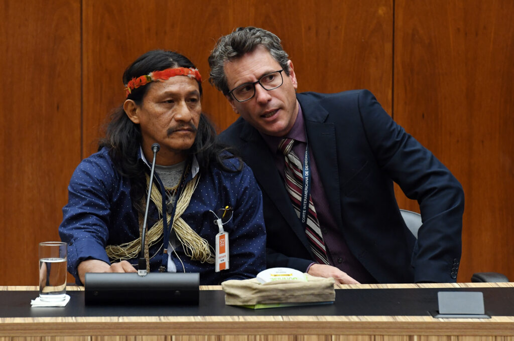 Penti Baihua appears with a translator before the Inter-American Court of Human Rights on August 23, 2022 for a hearing in the first-ever court case involving the rights of uncontacted Indigenous peoples. Credit: Courtesy of the Inter American Court of Human Rights. 