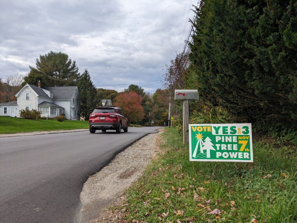 A political yard sign in Camden, Maine, supports the creation of a nonprofit electric utility in the state. Credit: Annie Ropeik